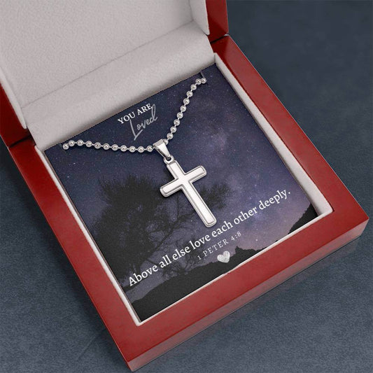 Camili'Bel 1 Peter 4:8 Faith Cross Necklace displayed in red gift box with inspirational message card and stainless steel cross pendant.