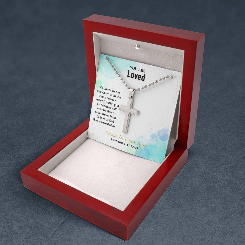 Open red wood gift box displaying Faith Cross Necklace with Romans 8:35,37-39 card, ideal for faith-based gifting.