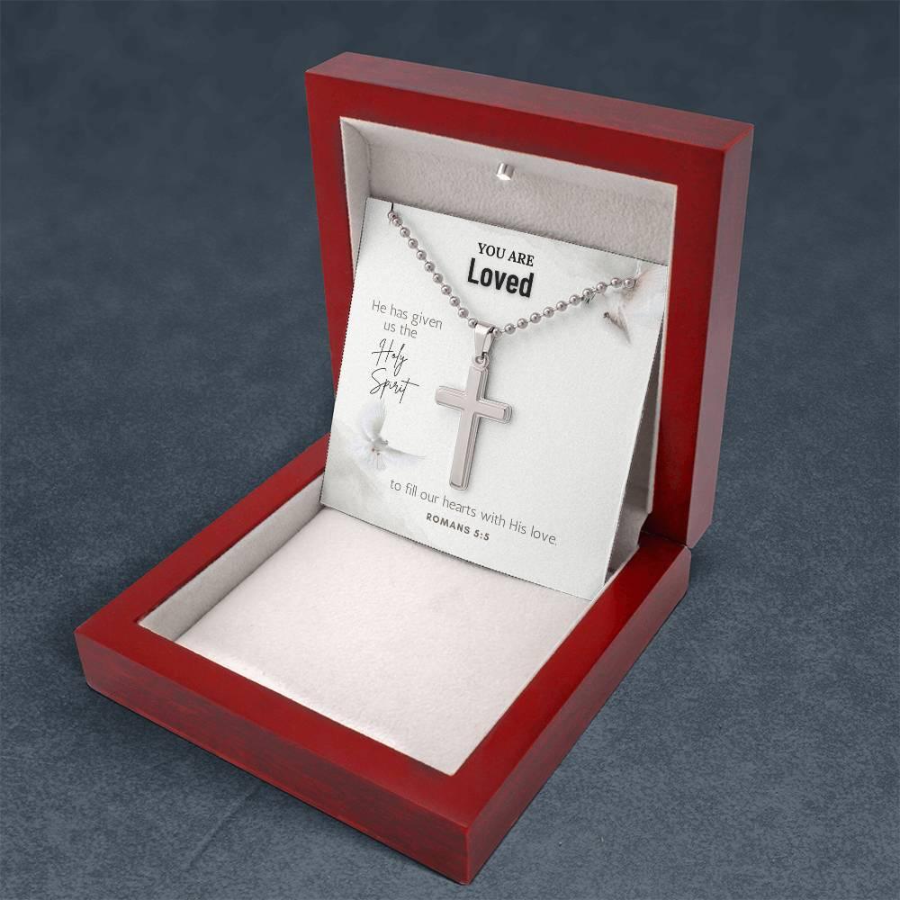Angled view of Romans 5:5 Faith Cross Necklace in red wood box with message card. Christian jewelry gift by Camili'Bel.
