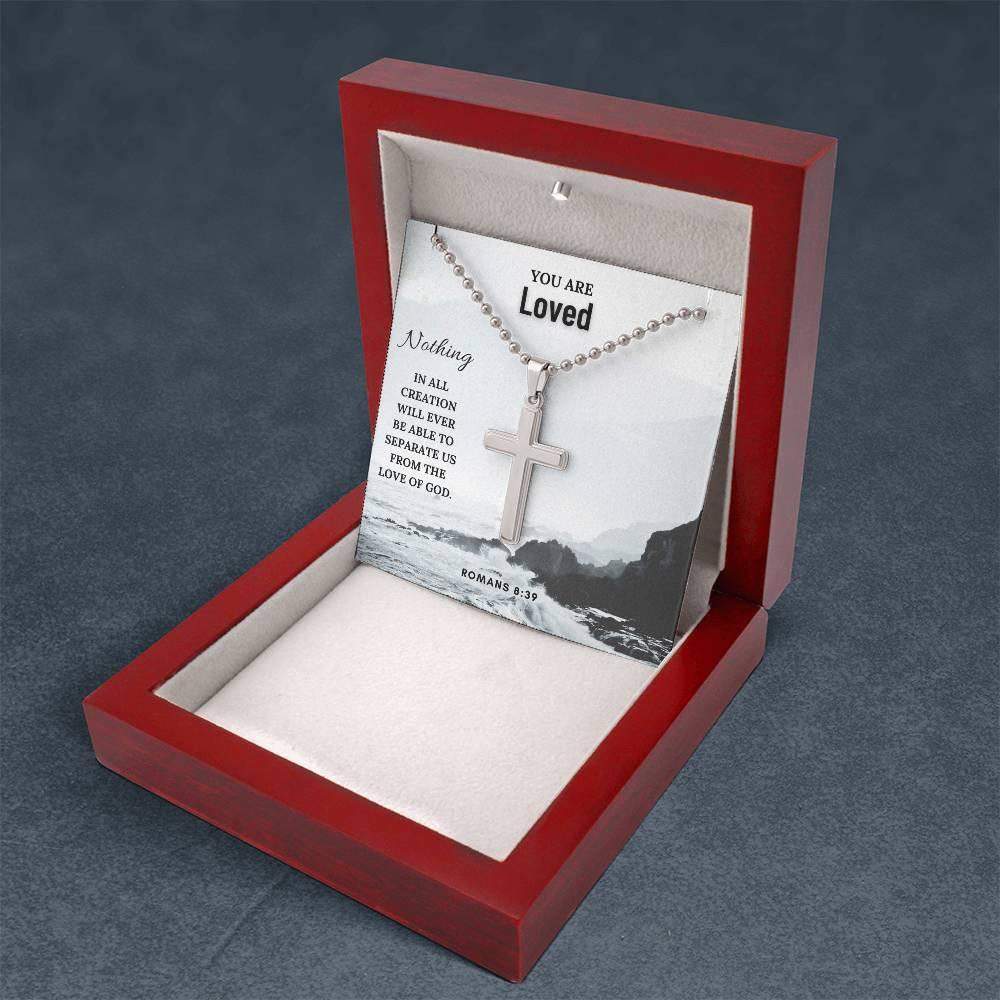 Open red wood gift box displaying Faith Cross Necklace with Romans 8:39 message card. Inspirational Christian accessory by Camili'Bel.