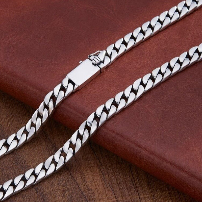 Close-up of Cuban link chain necklace showing premium polished finish and link detail
