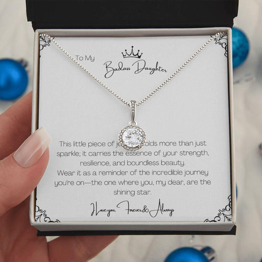 Necklace with a message card held by a hand, displayed against a neutral background.