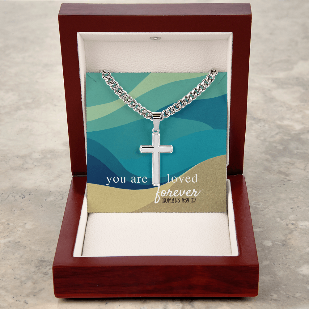 Artisan cross necklace with Cuban link chain in stainless steel, displayed in a wooden gift box with Romans 8:38-39 card. Faith jewelry for men.