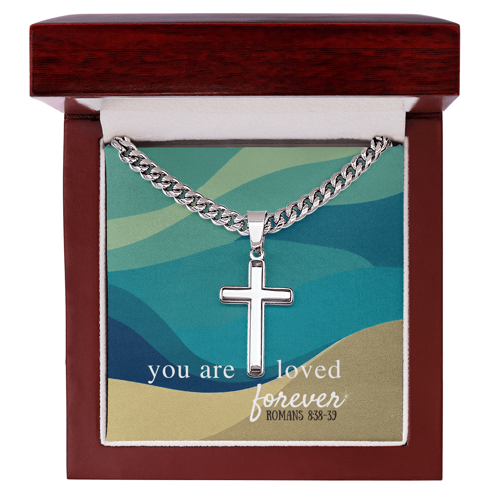 Artisan cross necklace with Cuban link chain in stainless steel, displayed in gift box with 'You are loved forever - Romans 8:38-39' message.